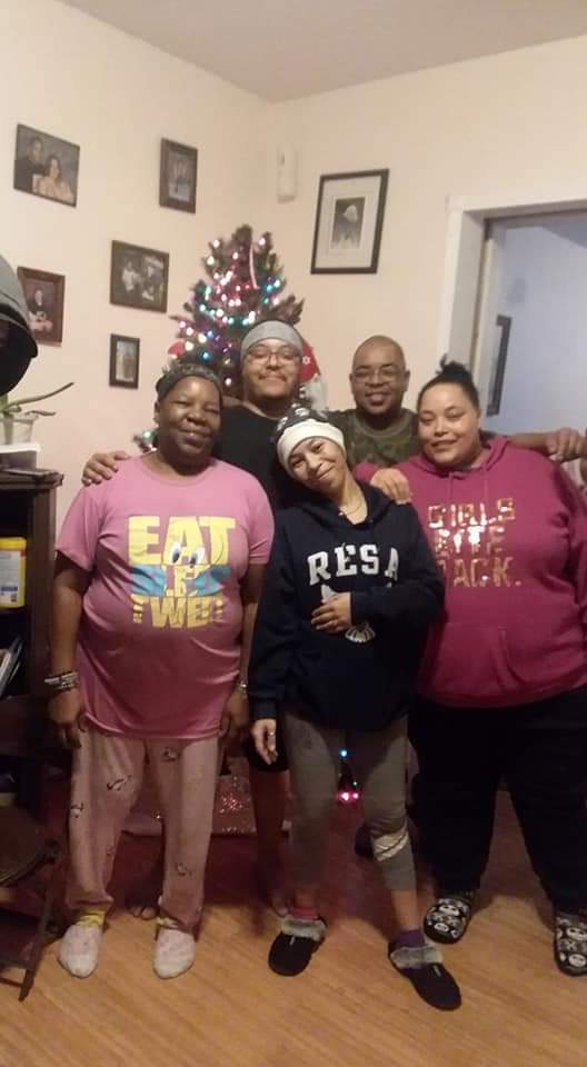 With siblings and mom